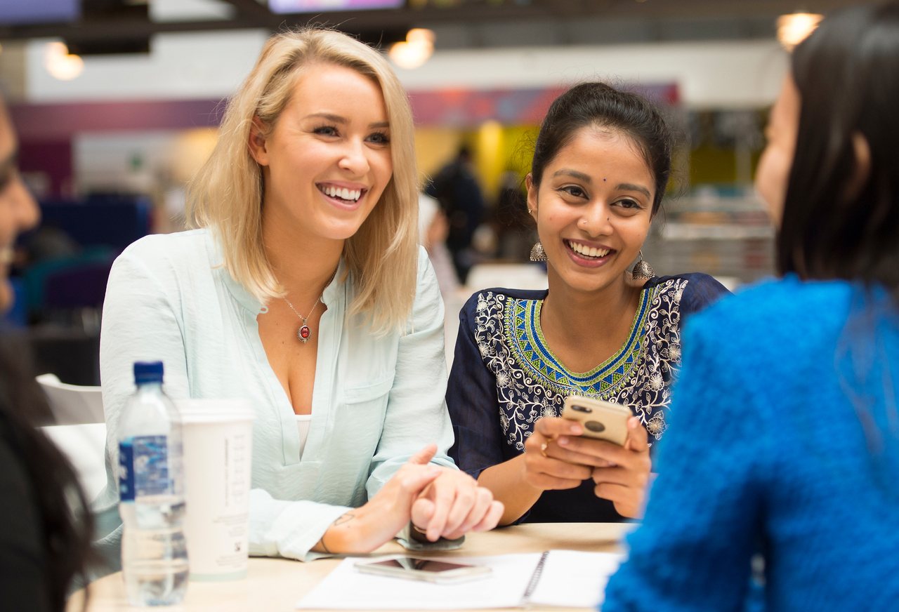 International Student Ambassadors in small groups working and socialising.