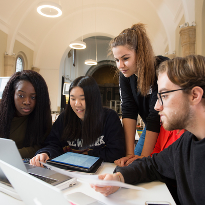 A group of different students working together