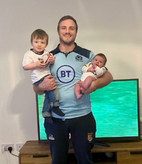 man holding children