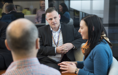 Three people talking
