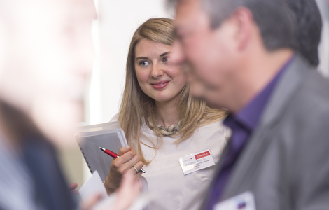 Camera focused on a student listening to another person talking