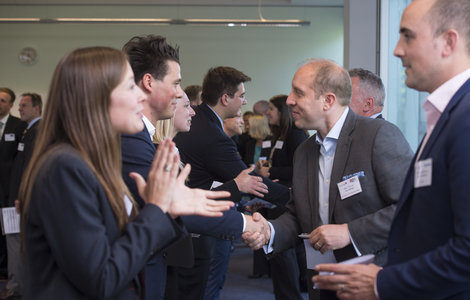 Photo of students meeting businessmen at industry event