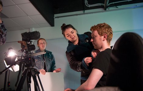 an actor getting dressed for a scene