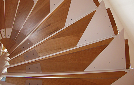 Close up of a wooden spiral staircase