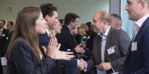 Photo of Edinburgh Napier University students meeting industry contacts at a business event