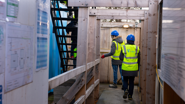 engineering students on site in high visibility vests and hard hats