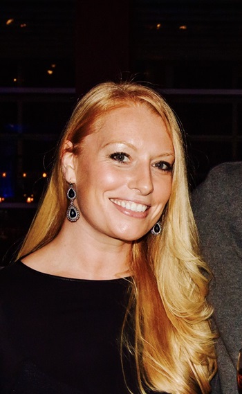 Leanne McQueen, leader of the New York Alumni Chapter, smiling into the camera