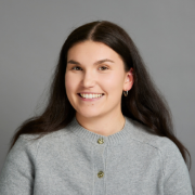 Headshot of Christy, Alumni team