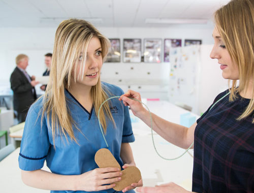 two women using medical biotechnology devices