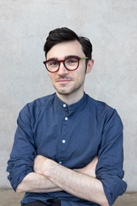 André Agius standing with his arms folded