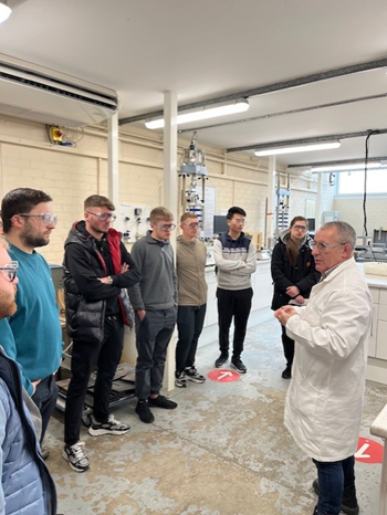 A group of students standing in a lab