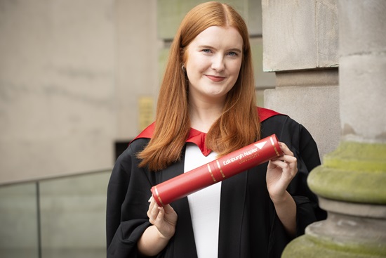 Emma Sullivan standing outside the Usher Hall with their degree