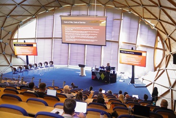 A speaker giving a talk in the Lindsay Stewart lecture theatre at Edinburgh Napier University