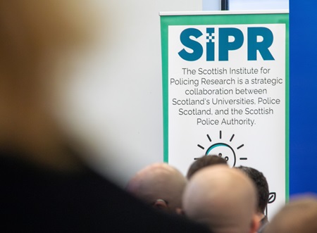 The SIPR logo on a vertical banner