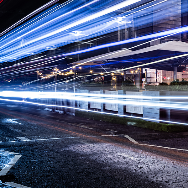 headlights blurring into lines with a slow shutter speed on an Edinburgh street
