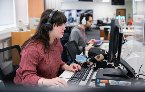 Journalism students working in news room