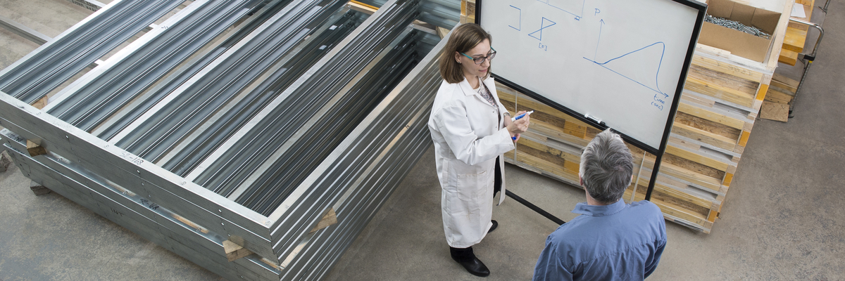 Lecturer Dr Katerina Marinelli talking to someone.