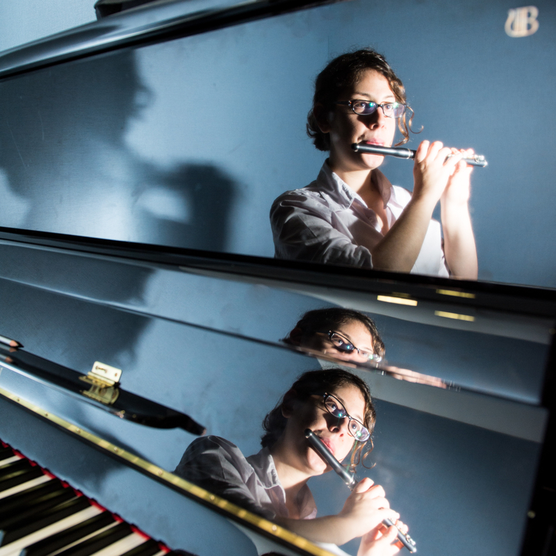 Student playing the flute.