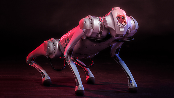 a dramatically lit robot with four legs like a dog, smooth, metallic, futuristic