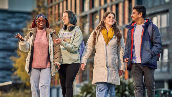 4 chatting students outside Bainfield Accommodation