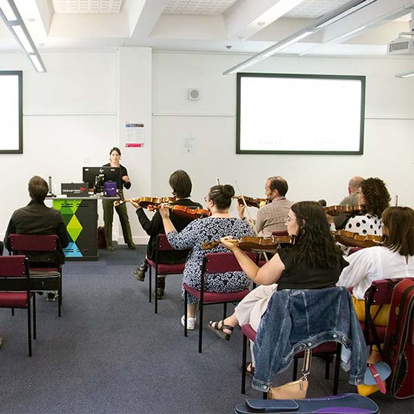 A group of adult students are taught by phd student arianna at Craiglockhart campus
