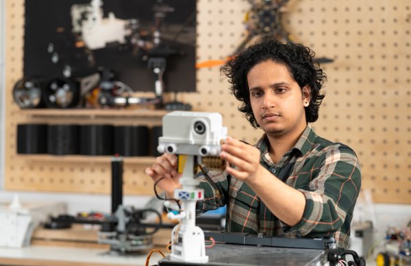 A photo of a student working on a project in our Robotics and Autonomous Systems Engineering lab at Merchiston campus. 