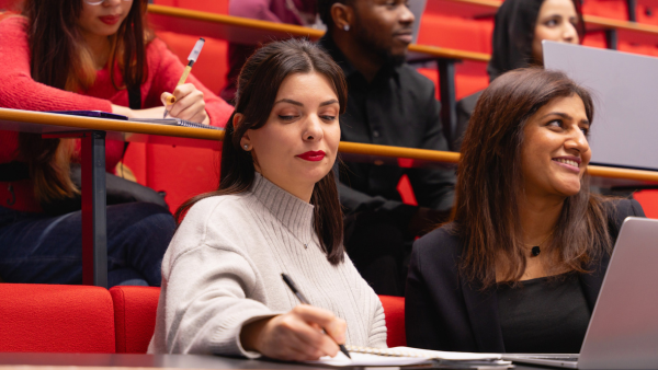 students taking notes in lecture theatre
