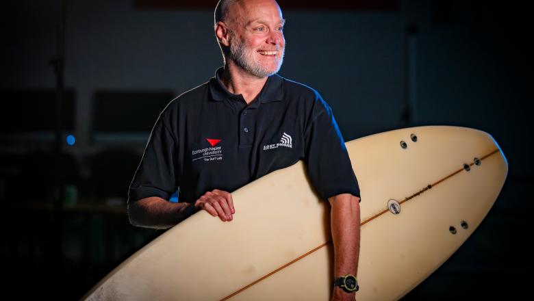 holding surf board