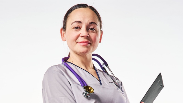 nurse holding a clip board
