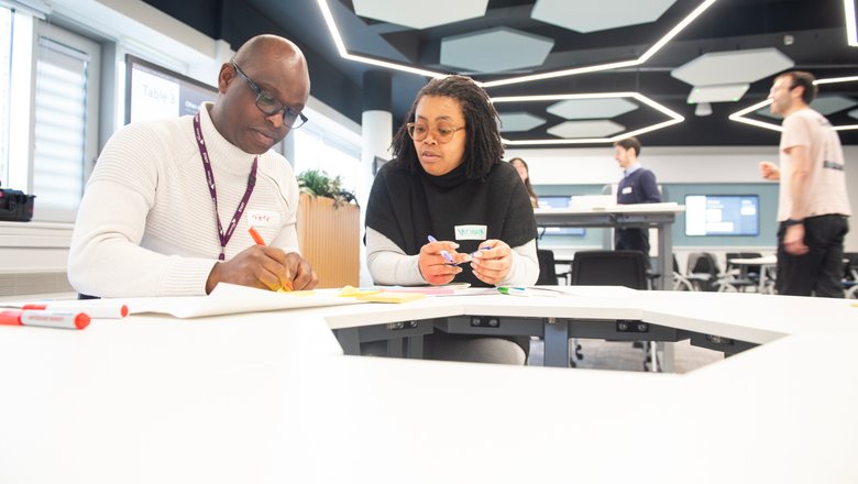 two academics at learning table