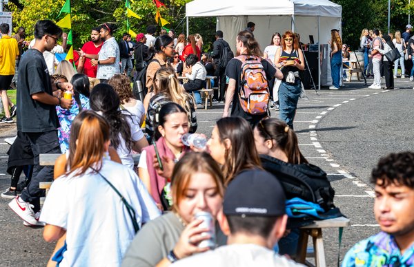 students gathering outside in the sunshine